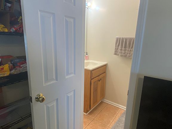 Ground floor 1/2 bath entrance (some furnishings shown, but will be offered unfurnished)