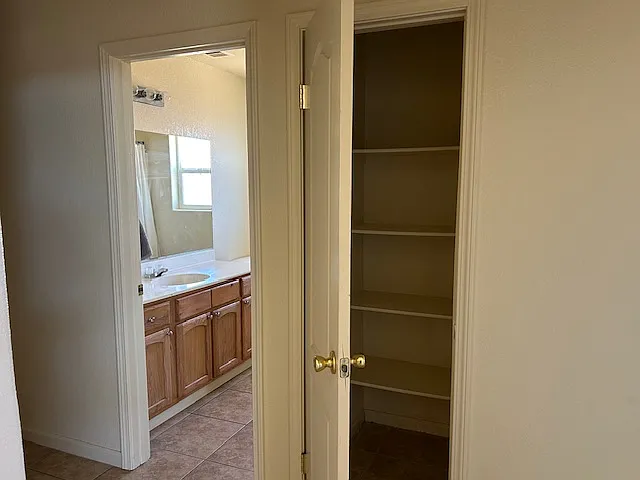 Linen closet and bathroom from hallway