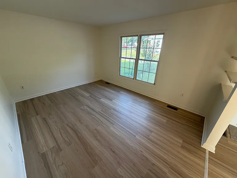 Family room offers large windows and a quiet retreat