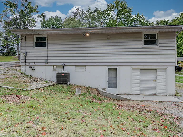 The rear of the home showing the walk-out doors