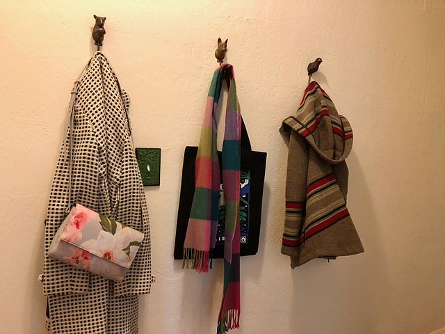 Animal-headed hooks in the hallway