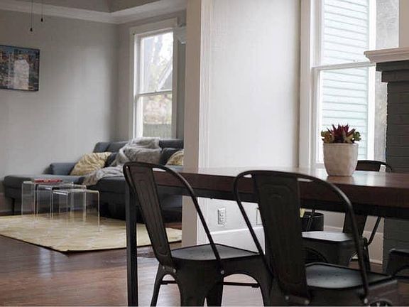 Dining room view and living room in background