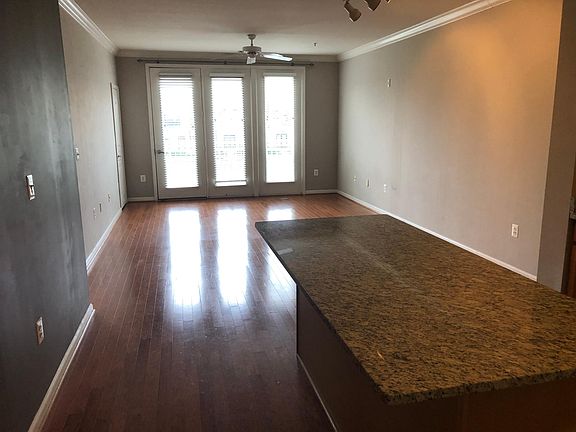 View of great room and island form front entry