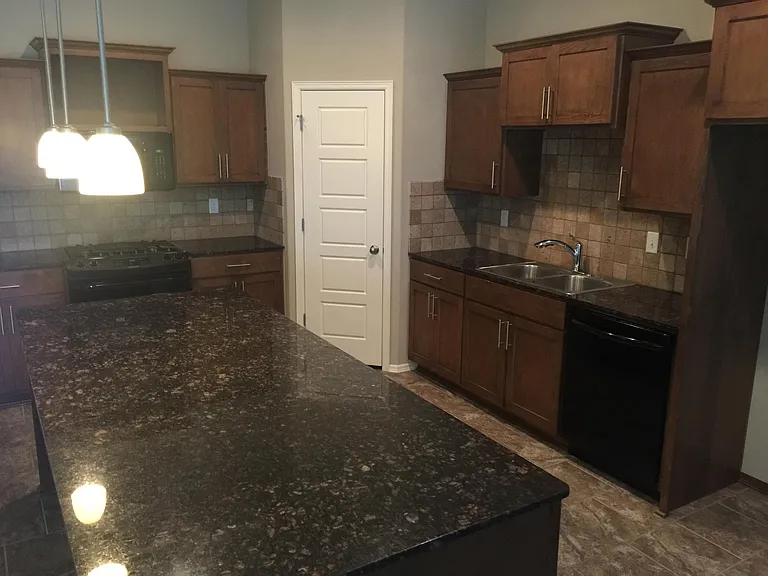 Open Kitchen with solid surface countertops