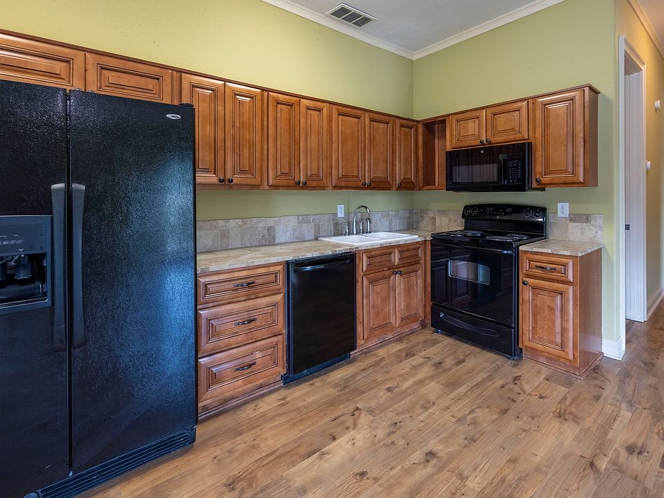 Expansive fully equipped kitchen. With large side by side fridge and freezer combo. Dishwasher and microwave with a large electric stove. Plenty of kitchen storage. Plenty of space to relax, entertain, or unwind after work.