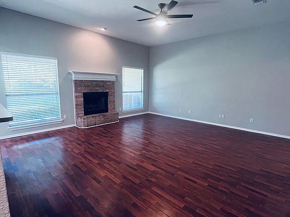 Large open living area next to kitchen.