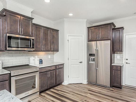 Open Kitchen with walk-in Pantry and Breakfast Bar