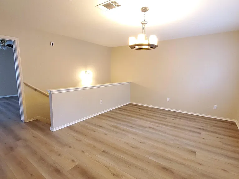 Upstairs living area with lots of windows and is perfect for game/play/media/flex room