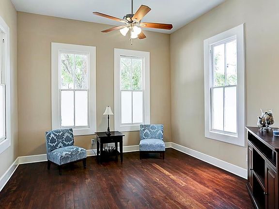 Roomy living room with 120 year old hardwood flooring.