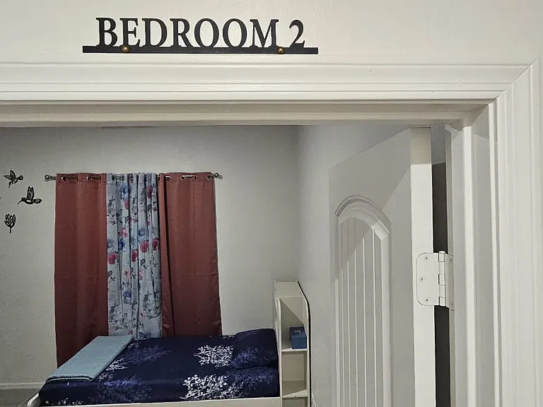 Bedroom 2 - 4 twin beds - 1 bunk bed & 1 twin bed with trundle. Sleeps upto 4 pax.