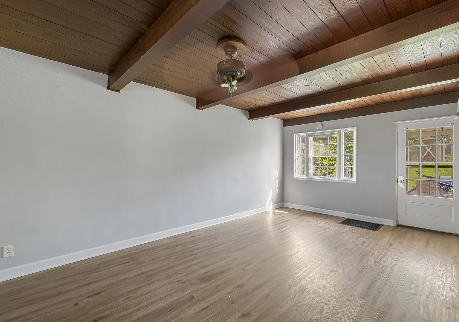 Home-Like Living with Sunroom, Attached Garage & In-Unit Laundry — Photo 2
