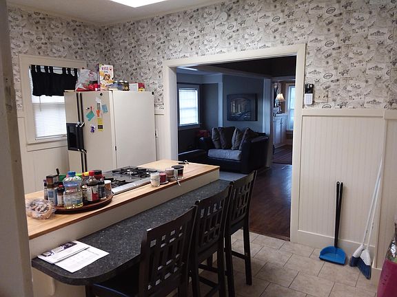 View into kitchen from back room.