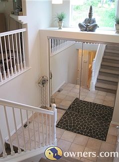 Open, bright entry with sliding coat closet