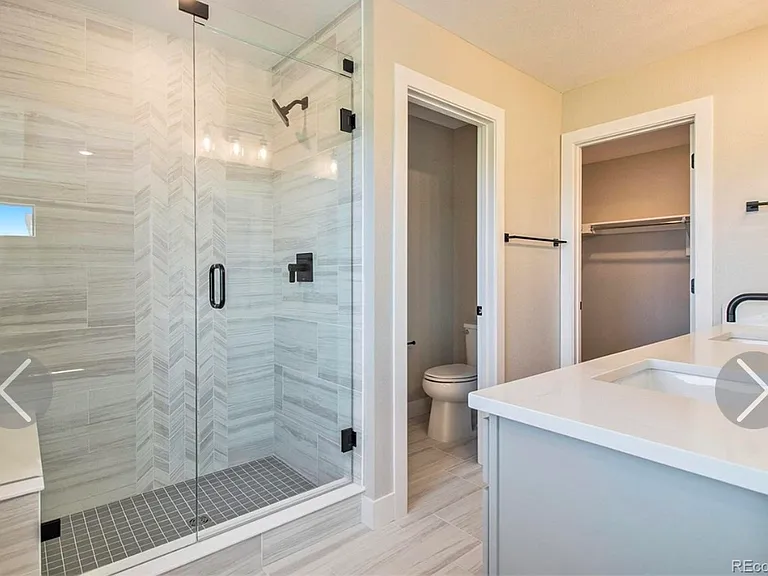 Master bathroom, 2 sink vanity, oversized wall in shower and large master closet