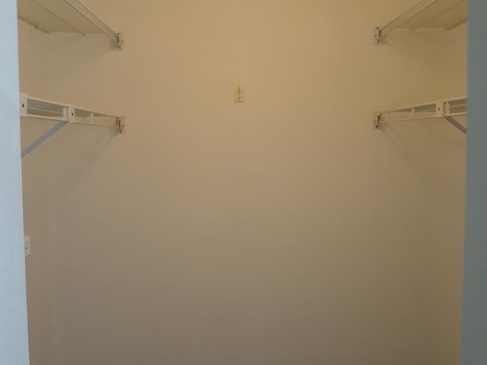 Back bedroom walk-in closet. Front bedroom, same size and set-up.