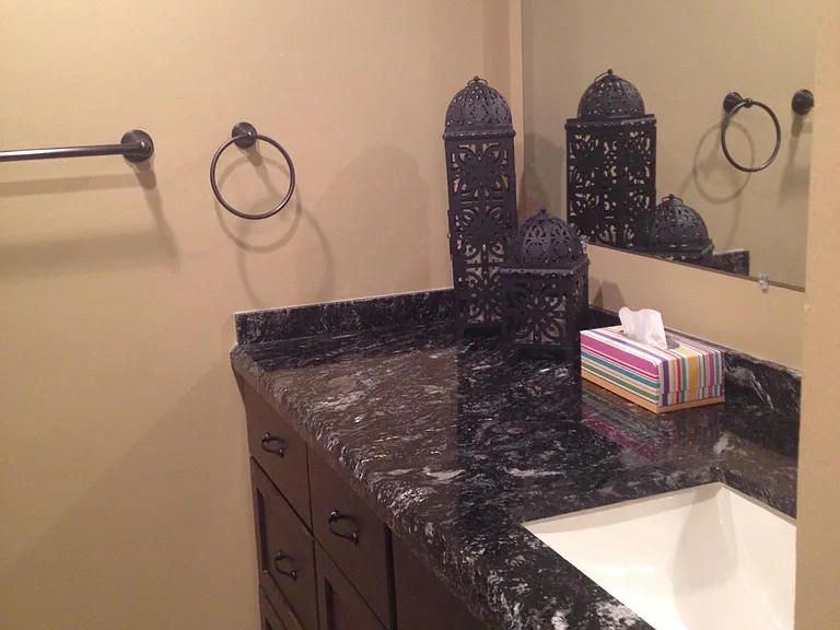 2nd bathroom with large vanity and granite counter top