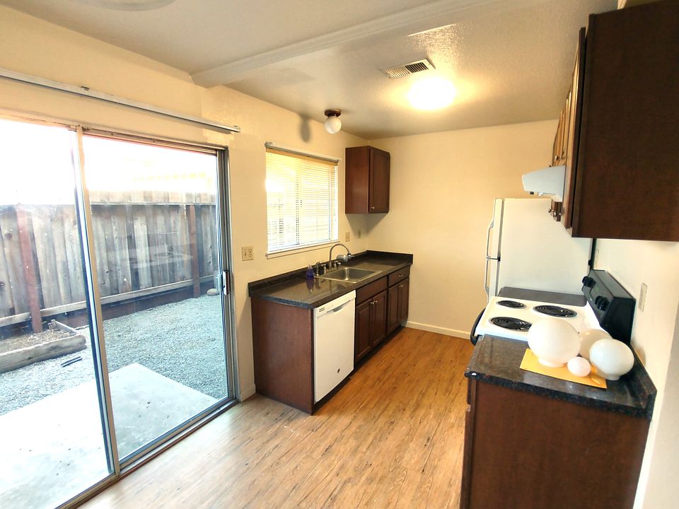 Kitchen, with view of the yard through slider.