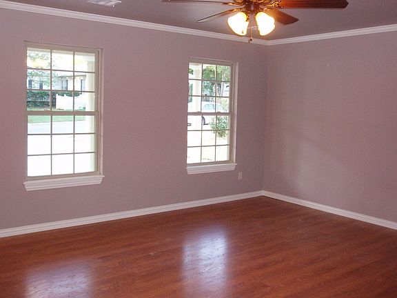 Large Living with Laminate Floors  Ceilng Fans throughout