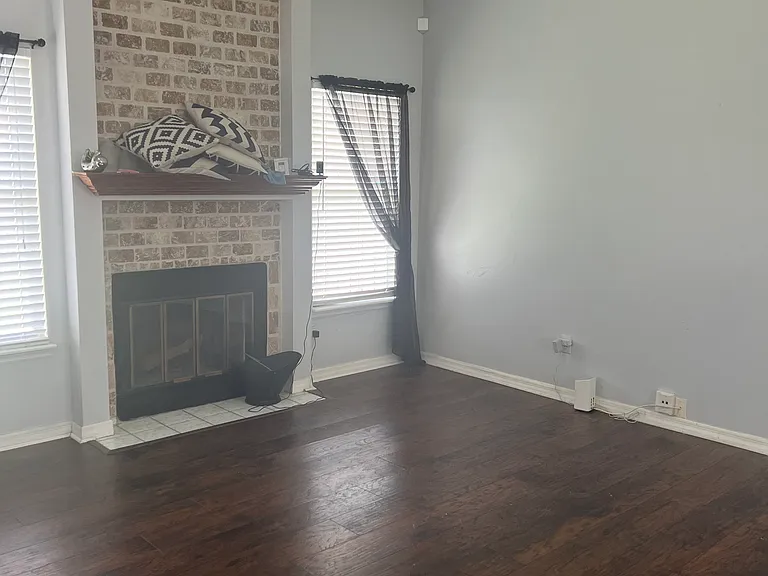 living room with wood-burning fireplace