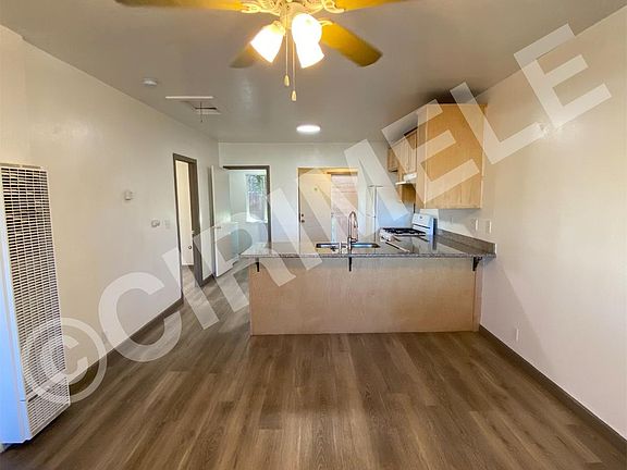 Living room with view of kitchen