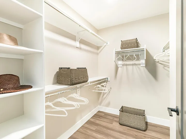 Spacious walk-in closets offer custom shelving and abundant storage, making it easy to keep your wardrobe beautifully organized.