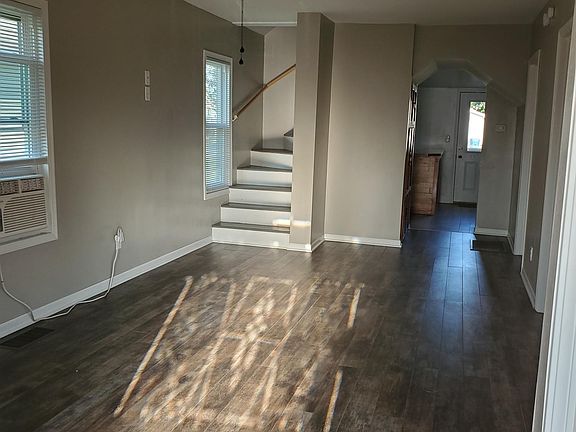 Living room with sunlight through front door
