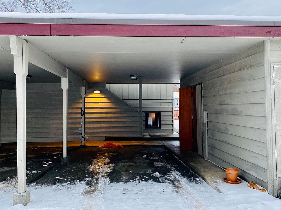 Covered parking with plug in for block heater. Storage unit to the right .