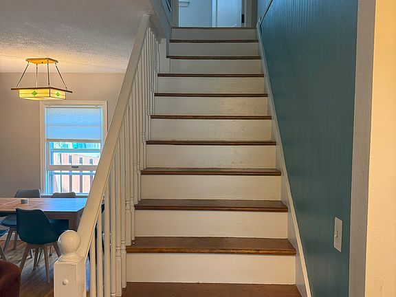 Stairs to finished half story bedroom/living area