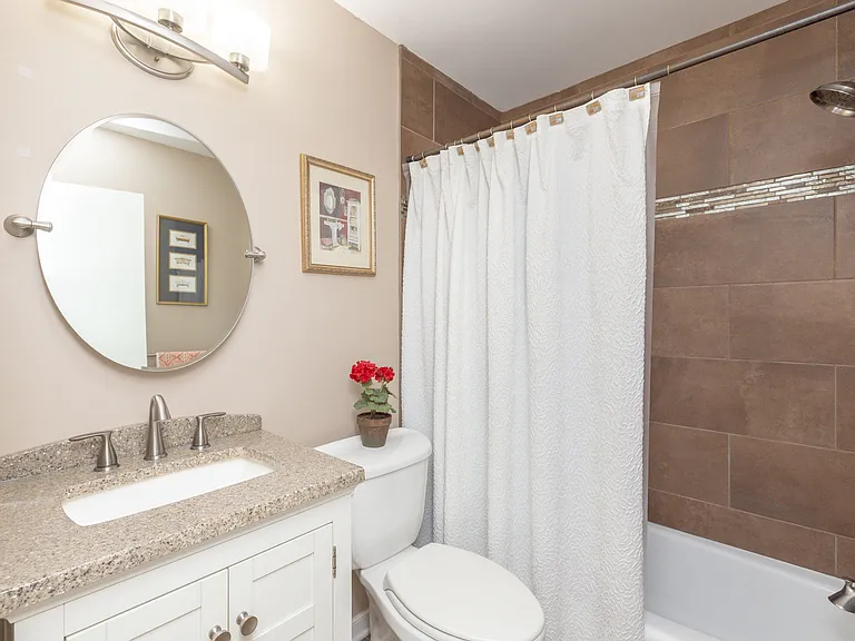 full bathroom in hallway shared