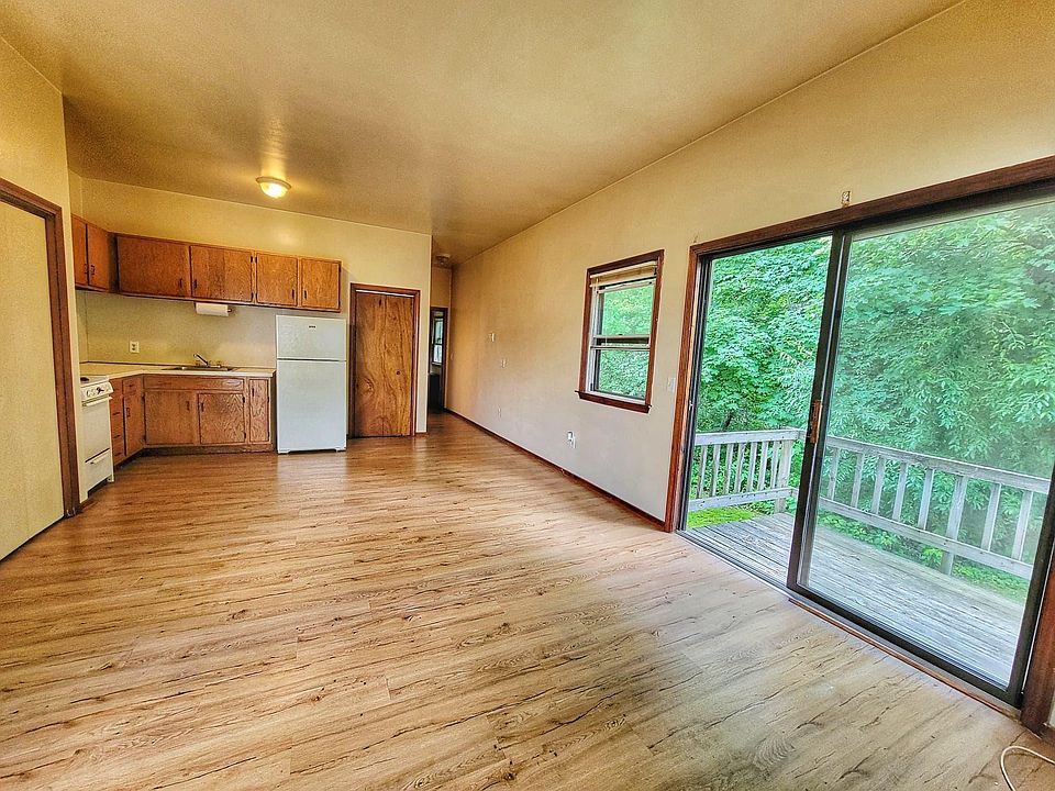 Open floor plan living room and kitchen over looking the deck
