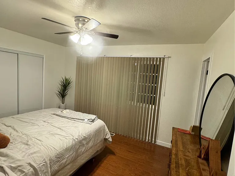 Master bedroom from different view with queen bed.