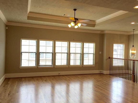 Open Living/Dining area with large windows that offer lots of natural sunlight
