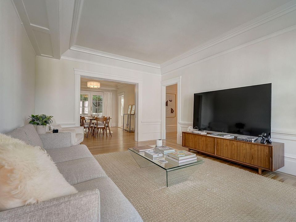 Grand but cozy living room overlooking Vallejo Street with soaring 12 ft ceilings and beautiful hardwood floors. There are also pocket doors from the living room to the dining room to close this room off, if needed.