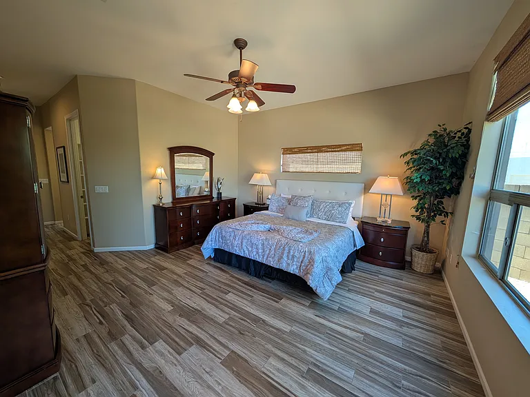 Primary bedroom king bed large walk in closet