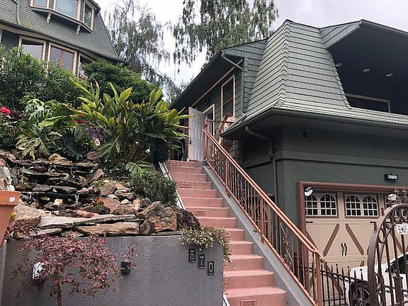 Unit is at top of stairs next to waterfall