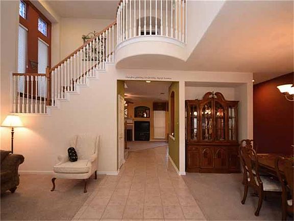 Beautiful two story entry welcomes you as you walk through the front door