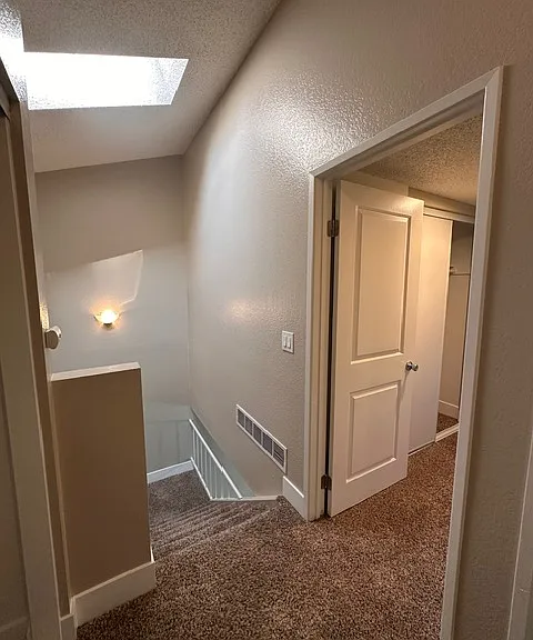 View from top of stairs, into bedroom 2
