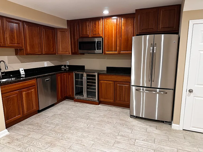 Wet bar in the basement with a 30 inches wine cooler