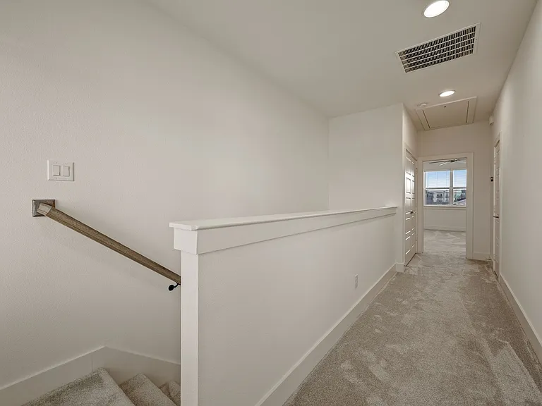 Main hall leading to the Master bedroom. The laundry closet is before the Master bedroom entry on the left.