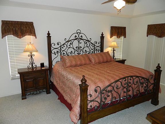 MASTER BEDROOM WITH KING SIZE BED AND HDTV.