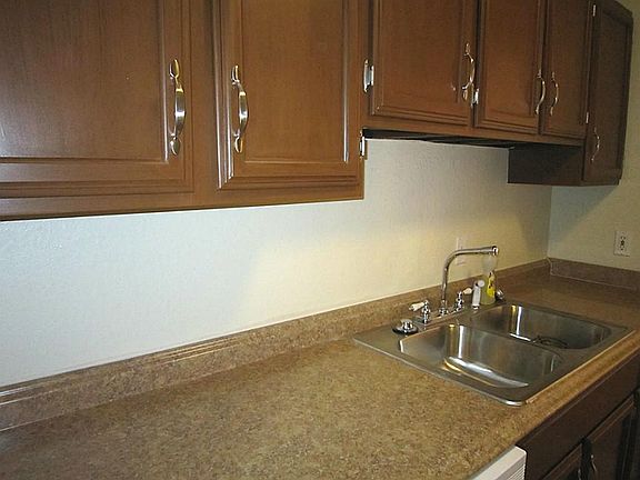  Fabulous kitchen with refinished cabinets with new hardware , new counter-tops, new sink,  new vent hood, and new dishwasher.