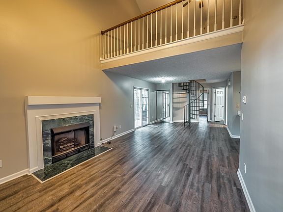 Two Story Greatroom with view of the Loft