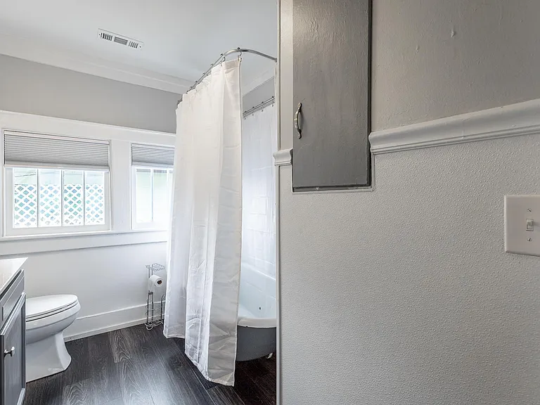 Front bathroom features an antique clawfoot tub!