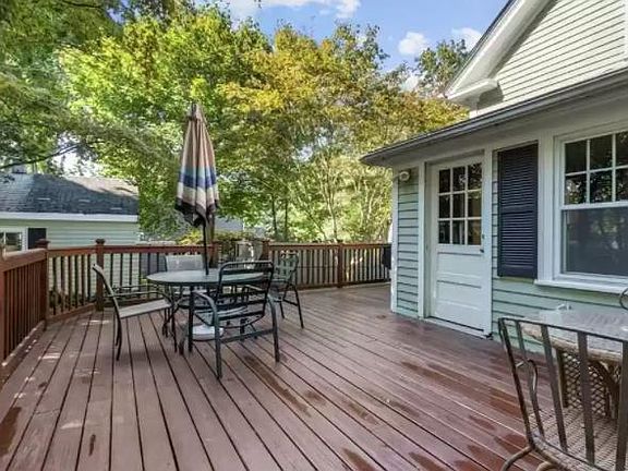 back deck; back door opens into "sun room."