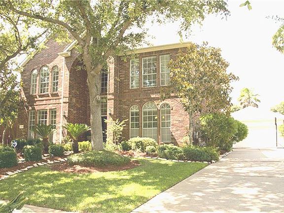 Lush landscaping fills this entire yard.