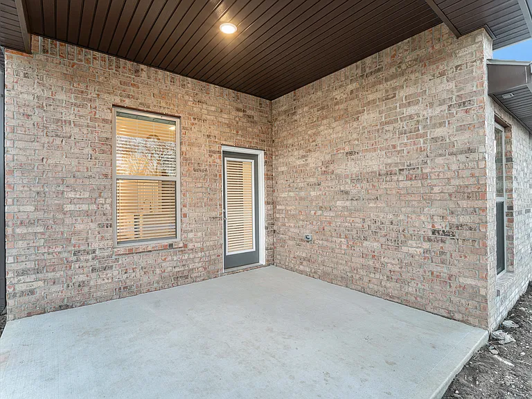 Backyard patio now has a ceiling fan installed.
