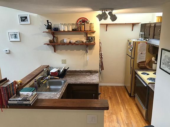 Kitchen, with 1/2 bath in back opposite refrigerator