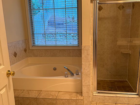 Master Bathroom with large tub and shower