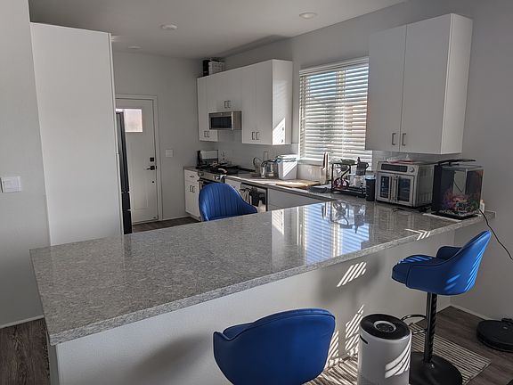 Fully furnished kitchen with counter.