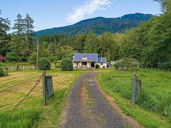 {WELCOME HOME} Located off of Sauk Prairie Road in Darrington, you will find a 4.614 acre home with Outbuildings, Barn and equestrian property. You wont believe this beauty with 360 degree views of the mountains.